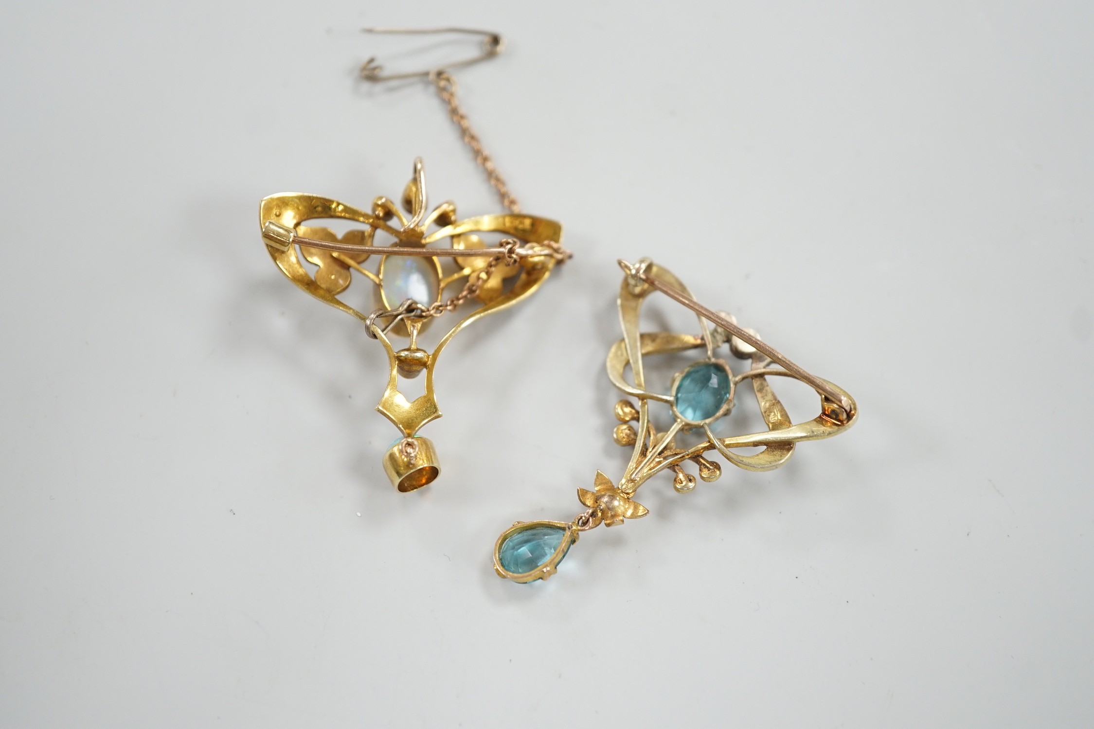 An Edwardian 15ct, white opal and seed pearl cluster set drop pendant brooch, 41mm, gross weight 5.8 grams and one other 9ct gem set drop brooch(a.f.), gross 4.2 grams.